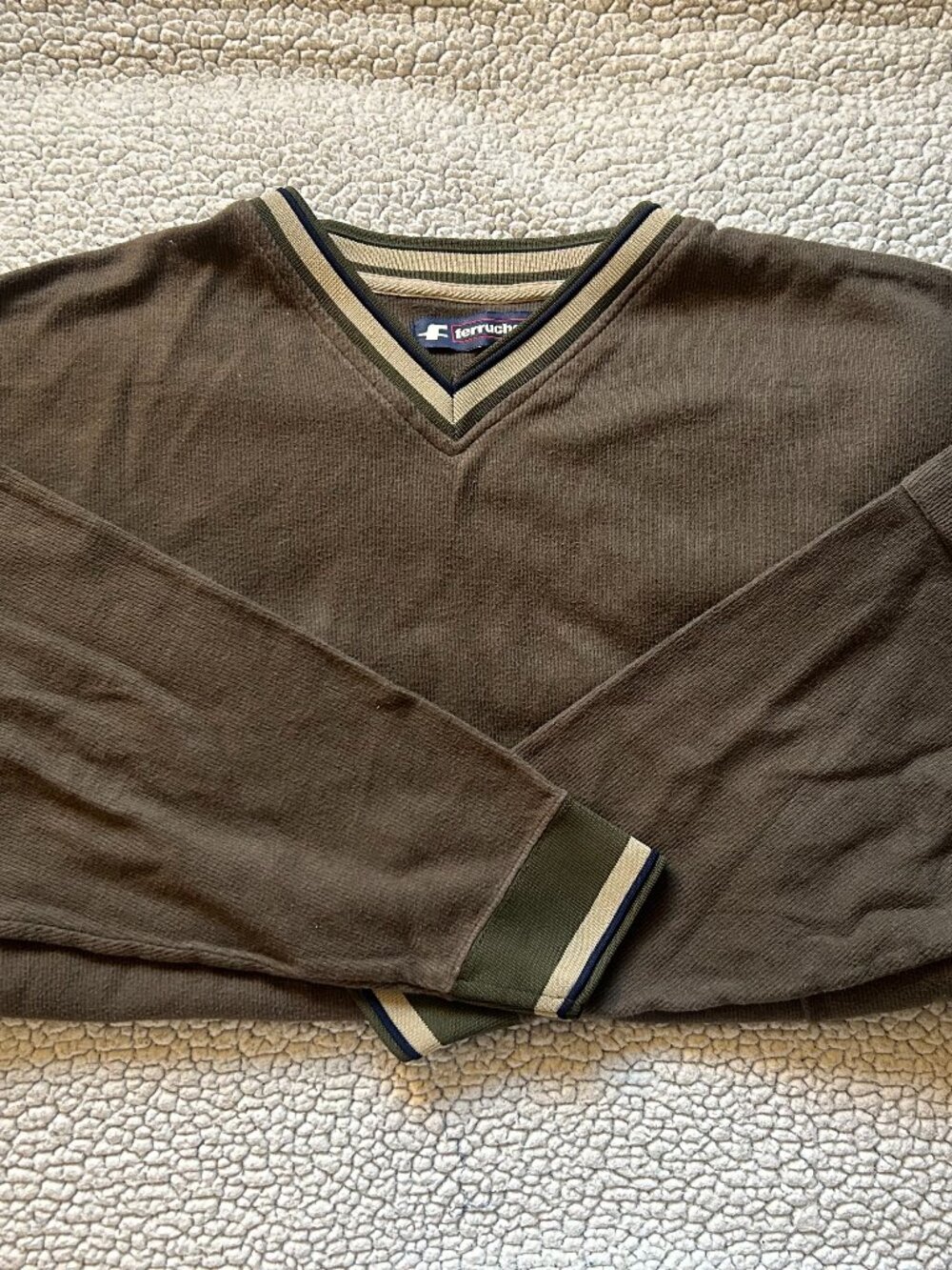 Ferruche -- green sweater, stripes on arms + neck, pocket on left sleeve, Mens L